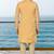 Mustard sherwani with pink and gold floral embroidery—perfect for festive weddings.