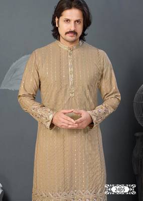 Beige kurta with colorful embroidery and gold pajama—perfect for weddings and festive occasions. 3
