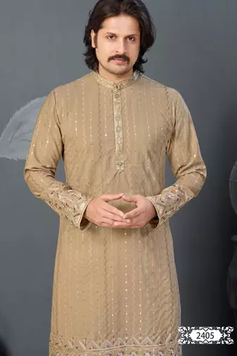 Beige kurta with colorful embroidery and gold pajama—perfect for weddings and festive occasions.