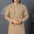 Beige kurta with colorful embroidery and gold pajama—perfect for weddings and festive occasions.