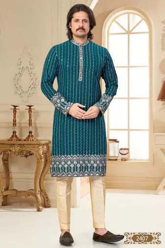 Teal blue embroidered kurta with cream pajama—perfect for festive occasions.