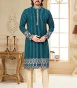 Teal blue embroidered kurta with cream pajama—perfect for festive occasions.