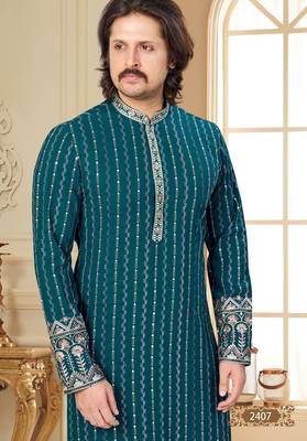 Teal blue embroidered kurta with cream pajama—perfect for festive occasions. 3