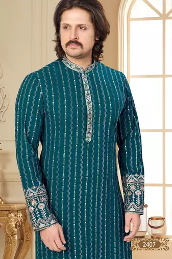 Teal blue embroidered kurta with cream pajama—perfect for festive occasions.