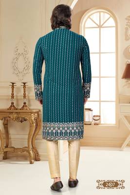 Teal blue embroidered kurta with cream pajama—perfect for festive occasions. 4