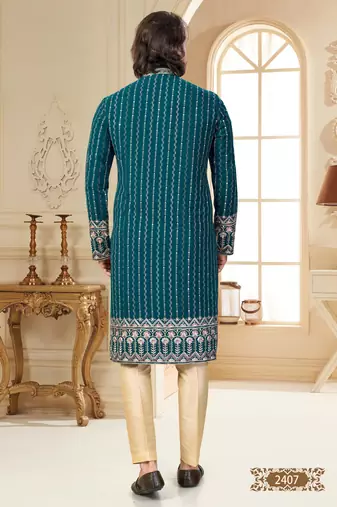 Teal blue embroidered kurta with cream pajama—perfect for festive occasions.