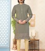 Olive green embroidered kurta with gold pajama—perfect for festive occasions.