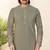 Olive green embroidered kurta with gold pajama—perfect for festive occasions.