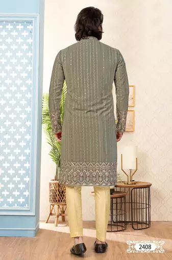 Olive green embroidered kurta with gold pajama—perfect for festive occasions.