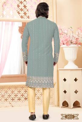 Sage green kurta with floral embroidery, paired with gold pajama—perfect for festive occasions. 4