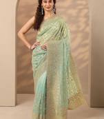 sea green embroidered nylon saree with unstitched blouse piece