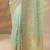 sea green embroidered nylon saree with unstitched blouse piece