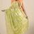 green printed satin saree with unstitched blouse piece