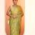 green printed satin saree with unstitched blouse piece