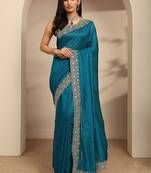 teal beads embellished saree with zari embellished border and a blouse piece