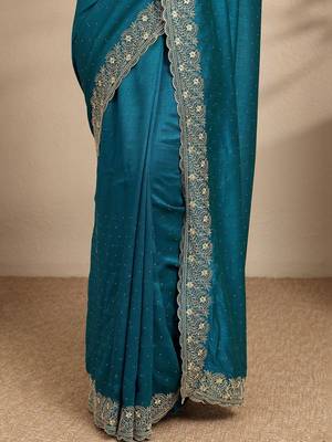 teal beads embellished saree with zari embellished border and a blouse piece 3