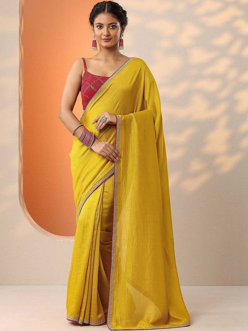 yellow solid saree with unstitched blouse piece