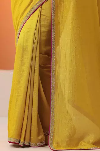 yellow solid saree with unstitched blouse piece