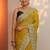 yellow embroidered saree with unstitched blouse piece
