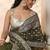 olive leaf green embellished satin saree with ethnic motifs