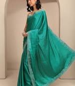 teal embellished saree with unstitched blouse piece