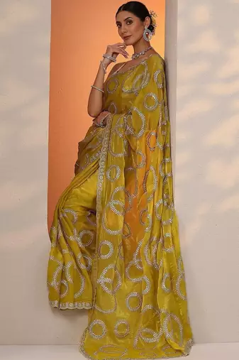 yellow embroidered organza saree with unstitched blouse piece