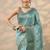 teal embroidered saree with unstitched blouse piece
