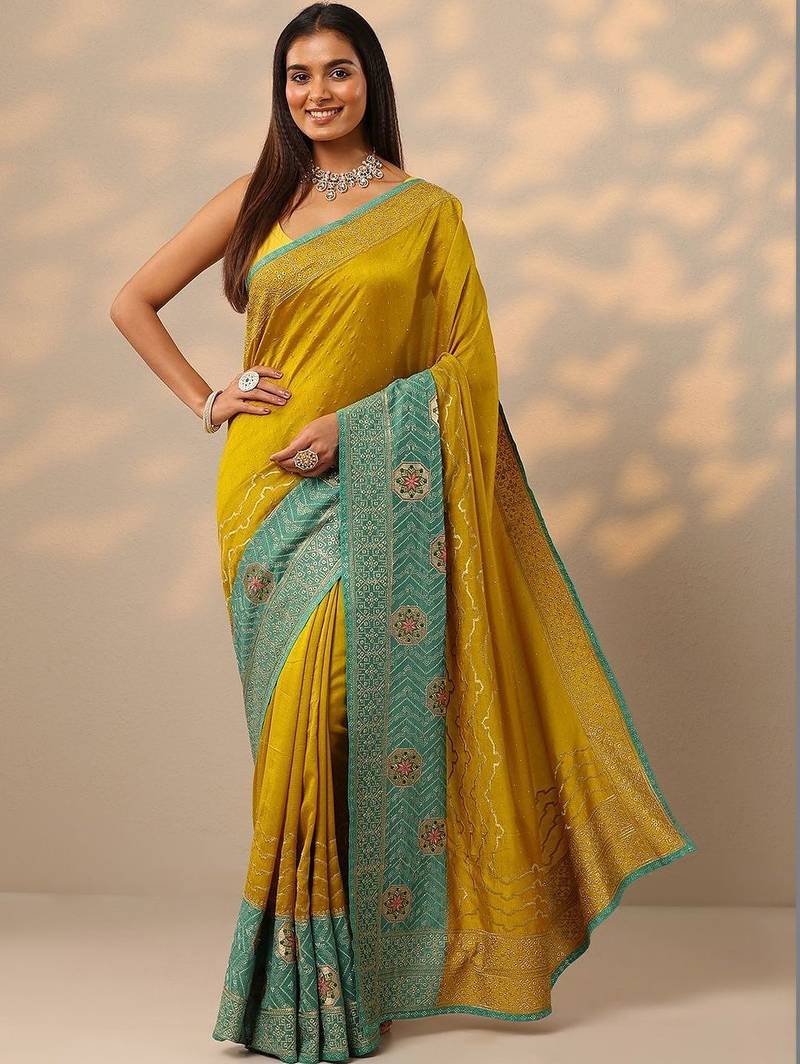 yellow embellished saree with unstitched blouse piece