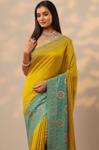 yellow embellished saree with unstitched blouse piece
