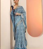 blue printed saree with unstitched blouse piece