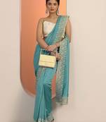 turquoise blue embellished saree with unstitched blouse piece