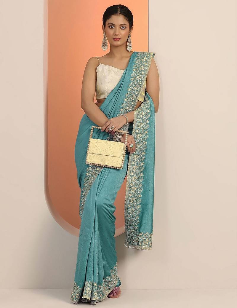 turquoise blue embellished saree with unstitched blouse piece
