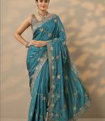 teal embroidered saree with unstitched blouse piece