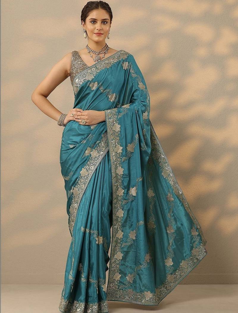 teal embroidered saree with unstitched blouse piece