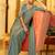 teal solid satin saree with unstitched blouse piece