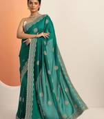 green embellished saree with unstitched blouse piece