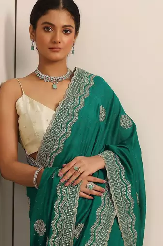 green embellished saree with unstitched blouse piece