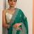 green embellished saree with unstitched blouse piece