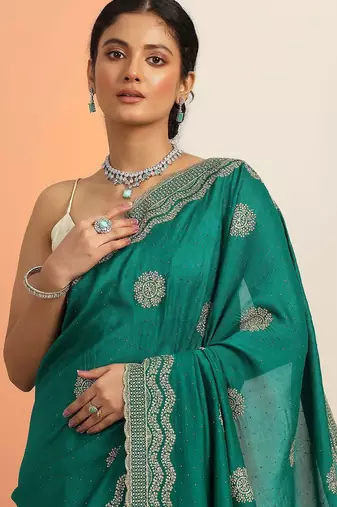 green embellished saree with unstitched blouse piece