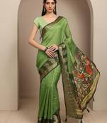 green paisley woven design saree with unstitched blouse piece