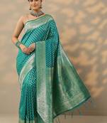 turquoise blue embellished banarasi saree with unstitched blouse piece