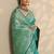 turquoise blue embellished banarasi saree with unstitched blouse piece