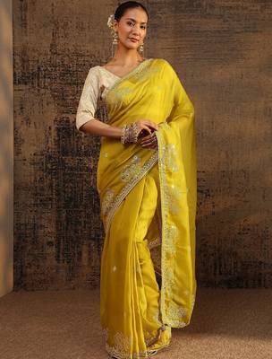 yellow ethnic motifs embellished tissue saree with unstitched blouse piece 1