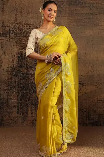 yellow ethnic motifs embellished tissue saree with unstitched blouse piece