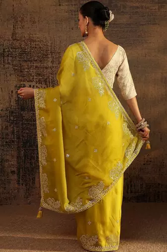 yellow ethnic motifs embellished tissue saree with unstitched blouse piece