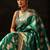 green woven design saree with unstitched blouse piece