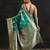 green woven design saree with unstitched blouse piece
