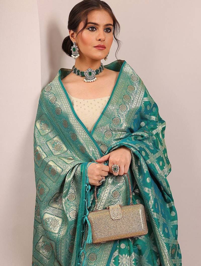 teal woven design banarasi silk blend saree with unstitched blouse piece
