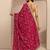 red tribal printed saree with unstitched blouse piece