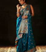 teal woven design saree with unstitched blouse piece